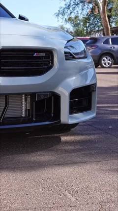 Silver BMW M2 parked at Phantom Tint in Mesa, AZ, ready for ceramic window tint